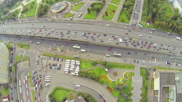 Day traffic on street and overpass bridge, aerial view, 