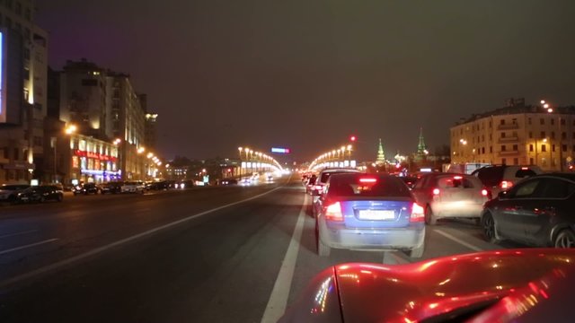 Evening city highway with jam of cars, view from cabin.