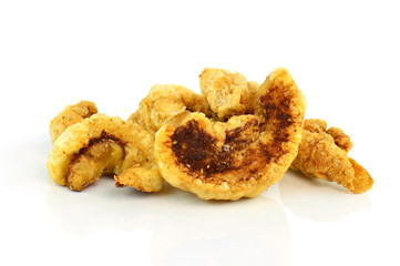 pork rind cracklings on white background
