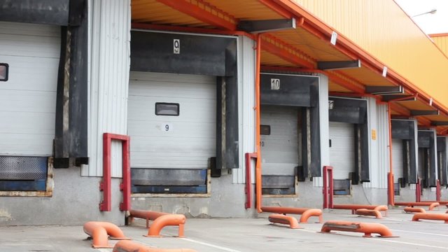 Row of gates for trucks to load goods on a large warehouse