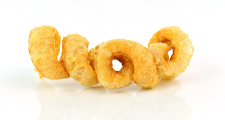 pork rind cracklings on white background