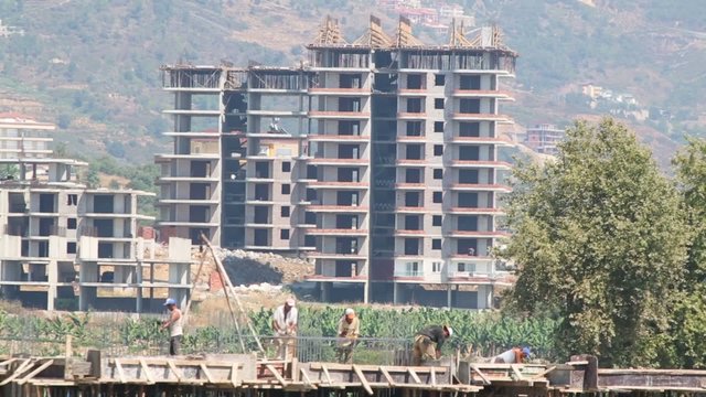 builders are working on the background buildings and mountains