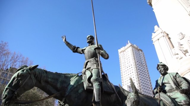 Monument to Cervantes on Esapan Plaza at day in Madrid, Spain.