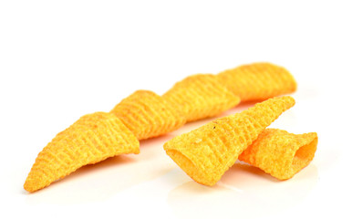 Crunchy corn snacks on a white background