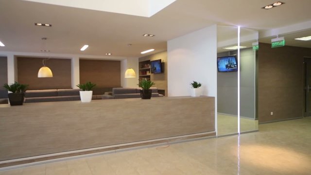 Front desk in reception hall and rest-room with sofas