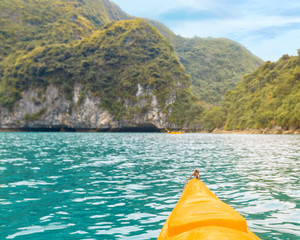 Trip on colourful kayak