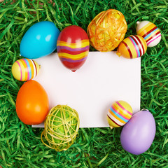 Easter eggs around white card