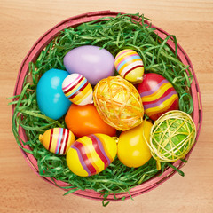 Basket full of colorful Easter eggs