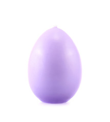 Egg shaped wax candle isolated