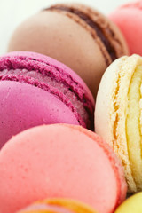 colorful macarons on wooden surface