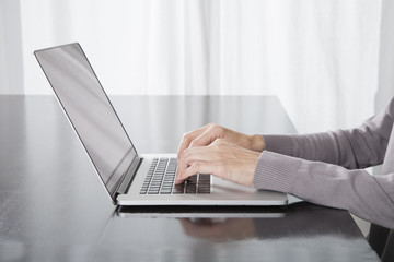 woman hands typing laptop