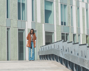 Beautiful girl posing in an urban context