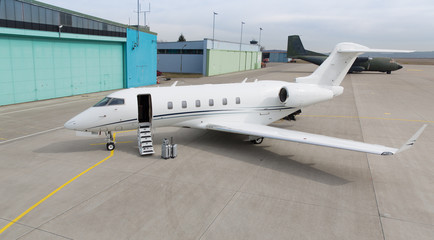 corporate private jet with luggage in front