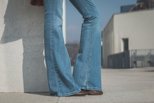 Detail of a girl posing in an urban context