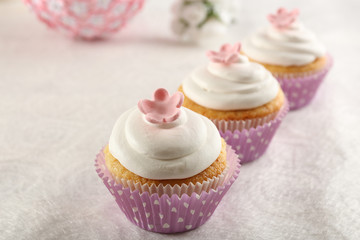 Delicious cupcakes on table close-up