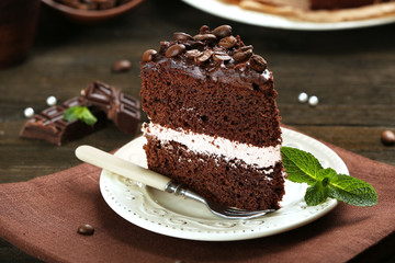 Delicious chocolate cake on table close-up