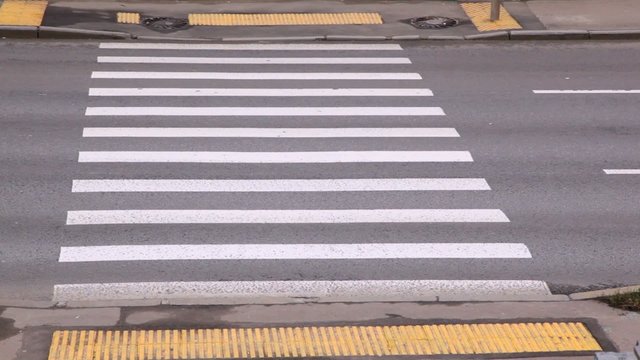 Crosswalk with car traffic in the afternoon