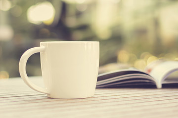 Coffee cup & book on wood table