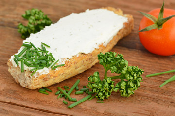 Fototapeta na wymiar Cream Cheese / Bread / Herbs / Tomato