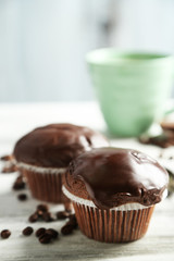 Tasty homemade chocolate muffins and cup of coffee