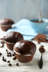 Tasty homemade chocolate muffins and cup of coffee