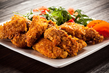 Fried chicken nuggets and vegetables
