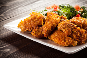 Fried chicken nuggets and vegetables