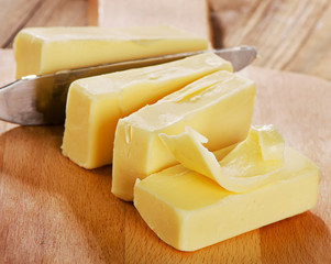 Butter on a wooden cutting board.