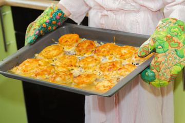 Woman holds homemade roasted meat