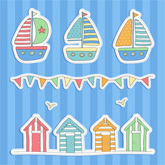 Colourful beach huts, bunting & boats