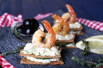 Appetizer canape with shrimp and olives