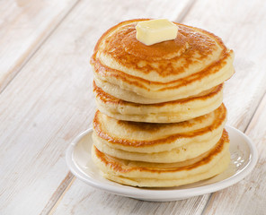 Stack of Small pancakes on  wooden table