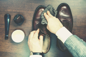 Shining and polishing leather shoes business man