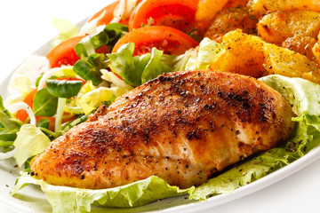 Fried chicken fillet, boiled potatoes and vegetable salad