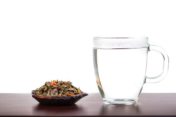 Aromatic antioxidant green tea on wooden board, isolated backgro