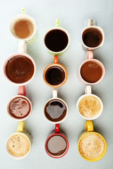 Many cups of coffee on table, top view