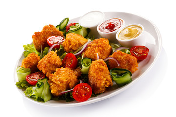 Fried chicken nuggets and vegetables