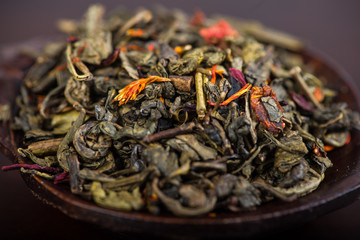 Aromatic antioxidant green tea on wooden board