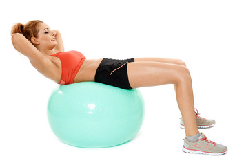 Athletic woman exercising with gym ball