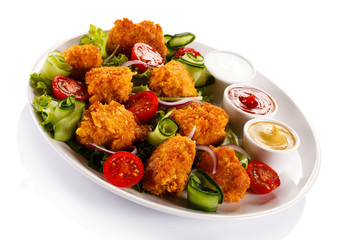 Fried chicken nuggets and vegetables