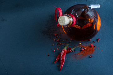 vibrant red hot chilli with olive oil