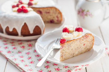 Banana Cake with Sugar Glaze Topped with Raspberries and Banana