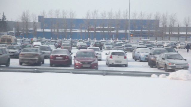 Large parking with lot of cars, trainview at winter day