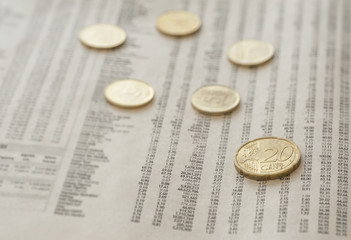 Coins on newspaper