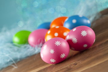 Fototapeta na wymiar Colored Easter eggs on blue background
