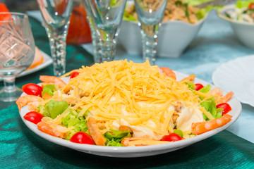 Caesar salad with shrimps in a plate