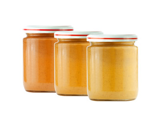 Jars of baby puree isolated on white