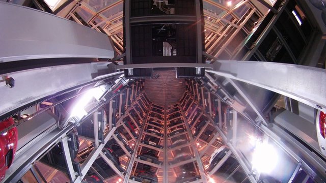 Inside of tower car storage facility, wide view, timelapse