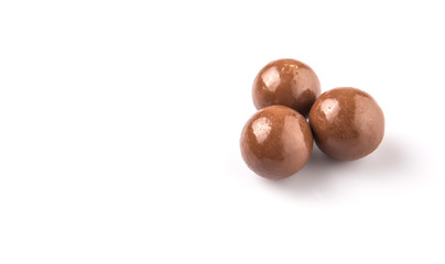 Chocolate balls with over white background