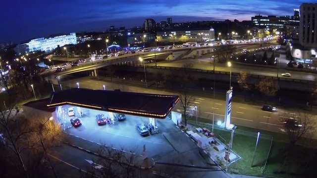 Cars refuel in filling station on quay near Sailors bridge